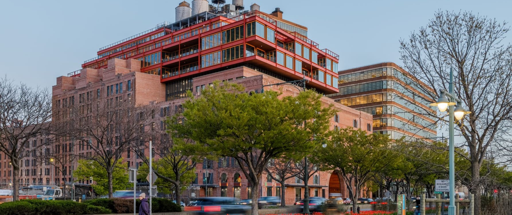 Historic brick exterior with greenery and people at Terminal Warehouse in West Chelsea New York